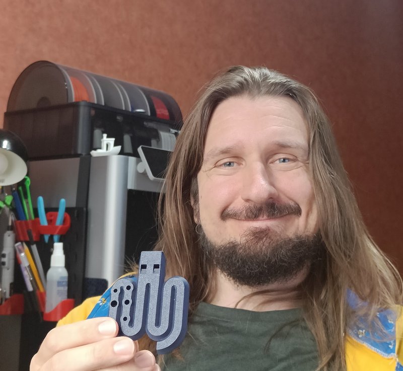 Mauri, founder of Tele Tunes, holding a 3D printed flute